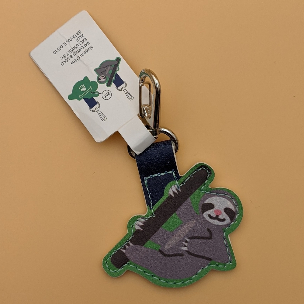 NWT Aldi Quarter Holder Keychain Hanging Sloth
